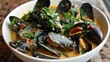 Mussels cooked in an aromatic broth with herbs - An enticing bowl of mussels steeped in a fragrant, herbal broth for a rich taste