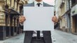 © Serhii - Businessman Holding White Sign with 'More Information' Message. A Dependable Concept to Connect with Your Digital Audience