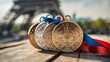 Olympic gold, silver and bronze medals with the Eiffel Tower in the background. Paris Olympic Games concept