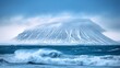   A snow-capped mountain rises from the center of a water body, waves gently lapping at its base, one cresting to ascend its side