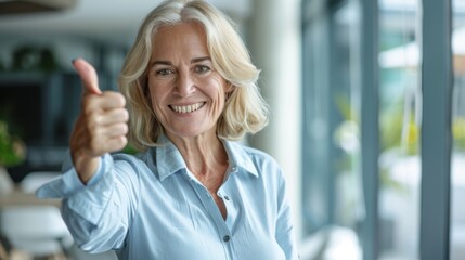 Wall Mural - Smiling Woman Giving Thumbs Up