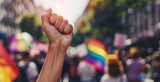 Fototapeta  - woman protests with raised fist on gay pride day
