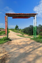 Entrance Arch Made Of Wooden Beam And Posts With Red Tile Roof Marking The Hiking Way To The Lago Valle Del Silenci Valley Lake. Viñales-Cuba-168