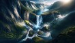 Spektakulärer Wasserfall mit Regenbogen im Bergtal