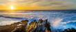 Panorama sunset over rocks and ocean with waves