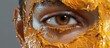 A close up shot of an eye with thick ornate metallic orange beauty makeup emphasizing the alluring and captivating nature of the female face