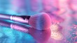Makeup brush with silver handle and pink bristles on blue and pink gradient background.