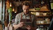 © buraratn - Man in restaurant tablet and inventory check small business
