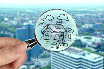 Wall Mural - Woman holding magnifying glass with drawing of house against city, closeup. Search for apartment