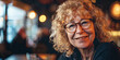 portrait of a beautiful senior woman with curly blonde hair and glasses smiling, generative AI