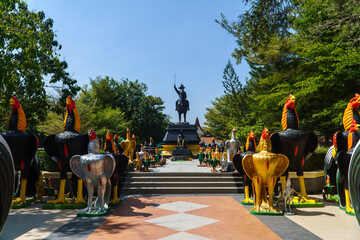 Wall Mural - Statue of King Taksin and rooster sculptures at Wat Huay Mongkol in Hua Hin, Thailand.