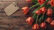 Spectacular Tulips with an empty tag on wooden background