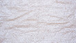 White plastic bubble wrap texture on cardboard paper sheet background, top view with copy space