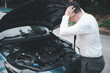 © sorapop - Asian businessman car broken breakdown, young stressed man having trouble car failure problem looking in frustration at failed engine in the morning, accident on road outdoor, late for work