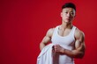© The Little Hut - Generative AI : Asian handsome young man with big muscle wearing white vest hand hold