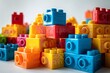 Close shot of colorful plastic building blocks of kids kept on a clean white surface for text or product advertisement, Generative AI.