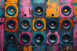 © CozyDigital - Wall consisting of large multi-colored music speakers. Musical background