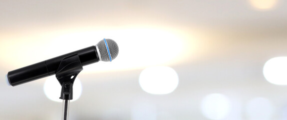 Wall Mural - Microphone for press conference speaker report interview concepts or broadcasting public speaking speech presentation stage performance and reporter news with empty copy space background.