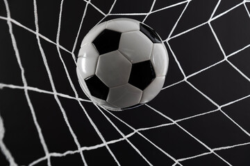 Canvas Print - Soccer ball goal success on black background