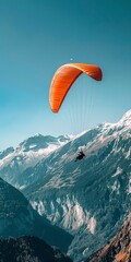 Canvas Print - Paraglider against mountains, close up, from below, clear blue sky 