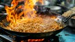 fried noodles cook in pan with big fire flame is hong kong style. Pad Thai favorite and famous Asian Thai street fast food in hot pan,