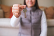 © Farknot Architect - Closeup image of a woman holding and giving the keys for real estate concept