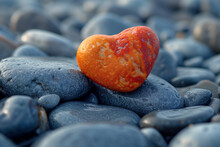 Heart-shaped Orange Rock Resting On Pebble Rock Pile Macro Nature Wallpaper Background