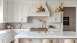 A kitchen with white cabinets, gold faucet and light hanging over the island