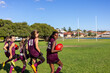 © Austockphoto - children in football team training on playing field