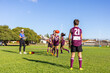 © Austockphoto - schoolchildren practising handball drills at football training