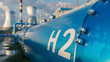 © john - Close up of an industrial 'H2' fuel storage tank with a hydrogen power plant background symbolizing the transition to net zero emissions by 2050