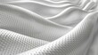   A tight shot of a white fabric showcasing undulating waves at its upper and lower edges