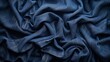   A close-up of a blue fabric textured with a cloth-like material, appearing authentic and genuine