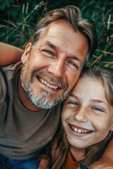 A man and a little girl laying on the ground, suitable for family and relaxation concepts