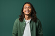 © Darya - Cheerful young man with flowing hair and green jacket, vibrant personality portrait.