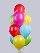 Multi-colored fountain made of helium balloons on a gray background