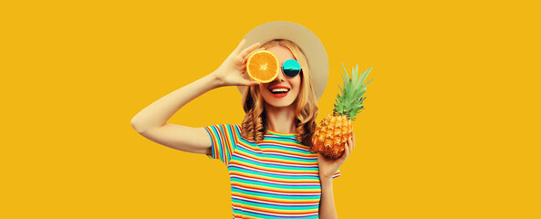 Poster - Summer vacation portrait of happy woman with fresh tropical juicy fruits on yellow background