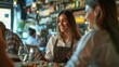Waitress using digital tablet while serving group of guests in pub