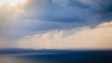 Fototapeta Na sufit - Dark storm rainy clouds on sea