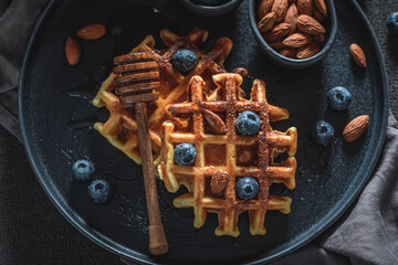 Wall Mural - Sweet dark waffles made of berries, almonds and cocoa.