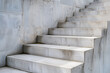 Closeup of stairs, made from white concrete with visible stone textures