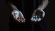 © YuDwi Studio - mysterious man give Red and blue pills on two hand isolated on black background,