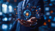 © Kolapatha - Business professional holding a glowing digital brain, representing artificial intelligence and innovation in technology.