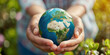Child and man holding Earth in hands stock photo