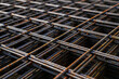 Rusty fittings. rusty construction metal mesh. Rusty Metal armature net for building construction. metal rebar for construction