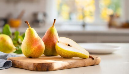 Wall Mural - A selection of fresh fruit: pears, sitting on a chopping board against blurred kitchen background; copy space
