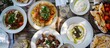 Authentic Greek dishes like moussaka, souvlaki, and tzatziki are staples in traditional Taverna menus. 