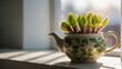 A charming cactus potted in a patterned teapot bathes in sunlight on a cozy windowsill