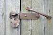 Old lock on the door. Locking device of an old farmhouse. Background.