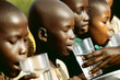 African children drink clean water from glasses outdoors